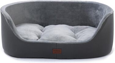 Кругле собаче ліжко RAIKOU середнього розміру, м'яке та зручне, з антиковзким покриттям. Підходить для собак та котів середніх порід (75 x 54 x 27 см), чорного кольору