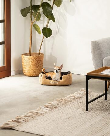 Ліжко для собак Lionto з двостороннім подушками та антиковзною основою, 50x37 см, бежево-коричневе. Підходить для собак та котів будь-якого віку. Міцне, з глибоким входом.