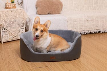 Кругле собаче ліжко RAIKOU середнього розміру, м'яке та зручне, з антиковзким покриттям. Підходить для собак та котів середніх порід (60 x 43 x 22 см, чорний)